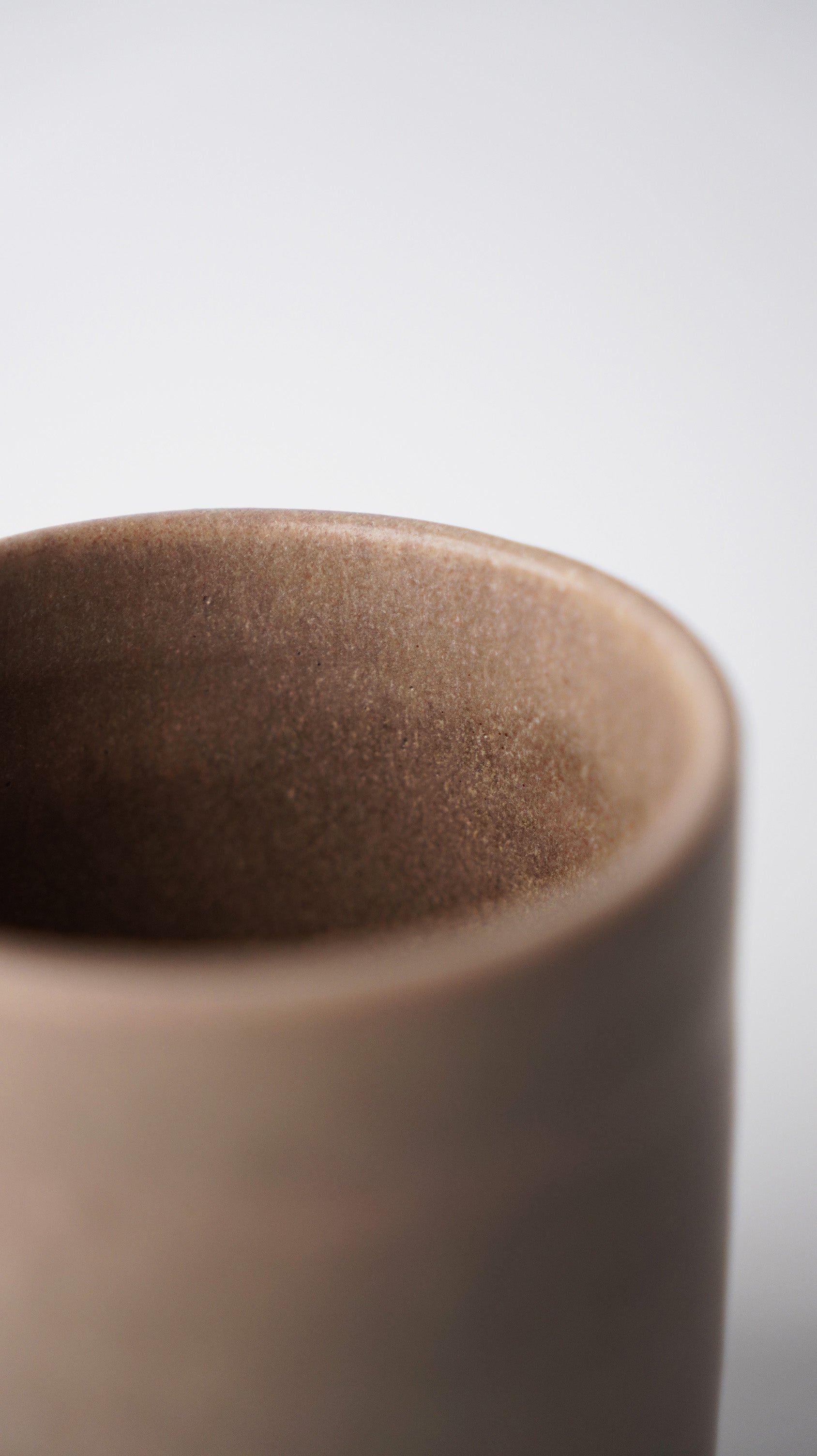 Collection of Everyday Mugs in Grain Stone, Indus Copper, and Smog Grey glazes